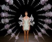 On July 1st, 2019, Iris van Herpen presented her latest Couture collection, titled ‘Hypnosis’,at Élysée Montmartre in Paris. nnThe collection is inspired by the hypnotic manifolds within our ecologies through the work of American artist Anthony Howe. The three-dimensional cyclical harmony of Howe’s kinetic sculptures is the wind beneath the wings of this collection. Howe&#39;s spherical ‘Omniverse’ sculpture explores our relationship with nature and intertwines with infinite expansion