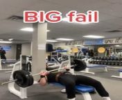 This man was attempting an extremely heavy bench press at a gym. Unfortunately, when he failed to lift the barbell, it landed on his belly. Eventually, he struggled hard to get it off his body.&#60;br/&#62;&#60;br/&#62;?The underlying music rights are not available for license. For use of the video with the track(s) contained therein, please contact the music publisher(s) or relevant rightsholder(s).?