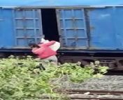 Thief hangs from moving train video