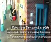 Shocking video shows the moment an e-bike exploded causing a massive fire while the owner stood on a platform waiting for his train.