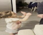 This little girl played a trick on her dad. She clenched one hand into a fist and covered it with another, asking her dad to open the &#92;
