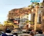 A fire in Valencia, Spain, engulfed two residential buildings, injuring at least seven people, with firefighters rescuing residents trapped on balconies as flames burst from windows of the 14-story building where the blaze started.&#60;br/&#62;