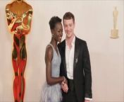 Red Carpet Fashion , at the 2024 Oscars.&#60;br/&#62;Red Carpet Fashion , at the 2024 Oscars.&#60;br/&#62;The 96th Academy Awards &#60;br/&#62;took place on March 10.&#60;br/&#62;The 96th Academy Awards &#60;br/&#62;took place on March 10.&#60;br/&#62;Here&#39;s a look at what stars wore to the event:.&#60;br/&#62;Here&#39;s a look at what stars wore to the event:.&#60;br/&#62;Cynthia Erivo, The &#39;Wicked&#39; star stunned in a green frilly dress.&#60;br/&#62;Ariana Grande, Grande turned heads in a pink puffy gown.&#60;br/&#62;Michelle Yeoh, &#39;The Brothers Sun&#39; actress sparkled in silver.&#60;br/&#62;Cillian Murphy, The &#39;Oppenheimer&#39; actor looked &#60;br/&#62;dapper in a black suit and bowtie. .&#60;br/&#62;Florence Pugh, Pugh stunned in a silver gown.&#60;br/&#62;Da&#39;Vine Joy Randolph, &#39;The Holdovers&#39; star looked &#60;br/&#62;radiant in a shimmering blue gown.&#60;br/&#62;Sandra Hüller, The &#39;Anatomy of a Fall&#39; actress stood out &#60;br/&#62;in a black gown with pointed shoulders.&#60;br/&#62;Zendaya, The &#39;Dune&#39; star rocked a pink dress with palm leaves.&#60;br/&#62;America Ferrera, The &#39;Barbie&#39; actress was mesmerizing in her shiny pink gown.&#60;br/&#62;Danielle Brooks, &#39;The Color Purple&#39; star commanded &#60;br/&#62;attention in a strapless corset black gown.&#60;br/&#62;Ryan Gosling, The &#39;Barbie&#39; actor wore a black suit with silver trim.&#60;br/&#62;Billie Eilish, The singer wore a white shirt with a blazer, &#60;br/&#62;paired with a tweed skirt and white socks.