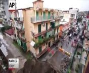 A 33 feet wide sinkhole opened up suddenly in a street in suburban Naples on Monday, after a burst underground water pipe and heavy rains caused the ground to give way.